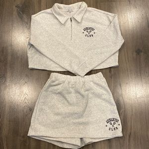 Matching sweater and skort, two-piece set. Sweater worn once, skort never worn.